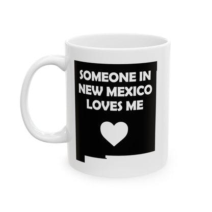 White mug with black design featuring 'Someone in New Mexico loves me' text and a heart symbol on a white background.