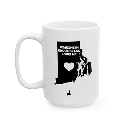 White mug with black map of Rhode Island and text 'Someone in Rhode Island loves me' on a white background