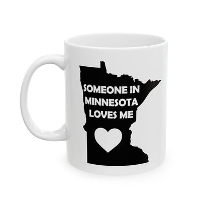 White mug with black design of Minnesota outline and text 'Someone in Minnesota loves me' on a white background
