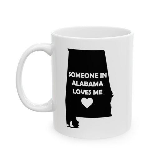 White mug with black silhouette of Alabama and text 'Someone in Alabama loves me' on a white background