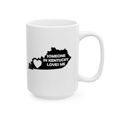 White mug with black text and heart design on a white background with text  Someone In Kentucky Loves Me