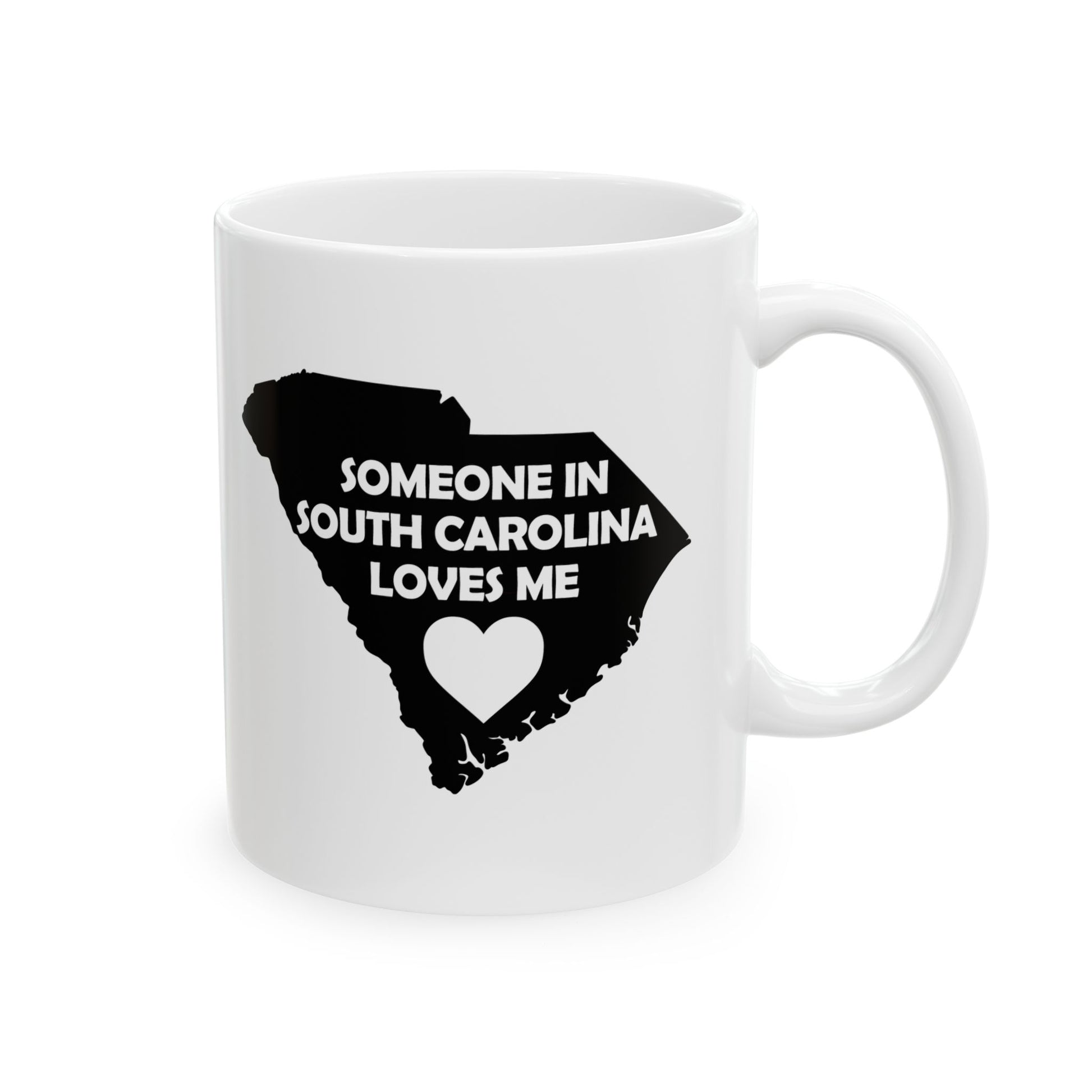 White mug with black silhouette of South Carolina and text 'Someone in South Carolina loves me' on a white background