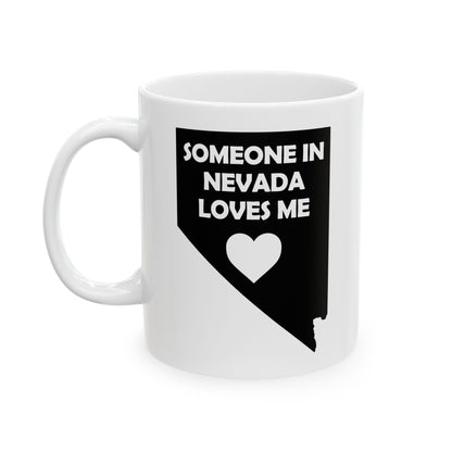 White mug with black design of Nevada map and text 'Someone in Nevada loves me' on a white background