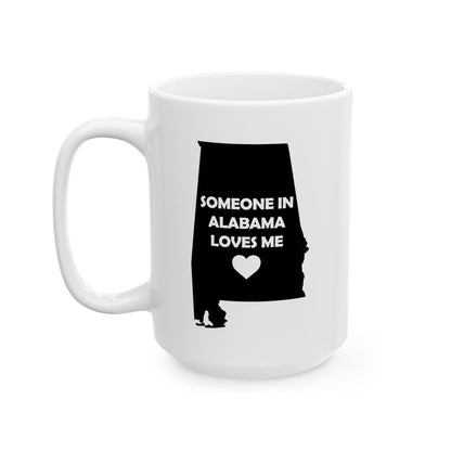 White mug with a black silhouette of Alabama and text 'Someone in Alabama loves me' on a white background