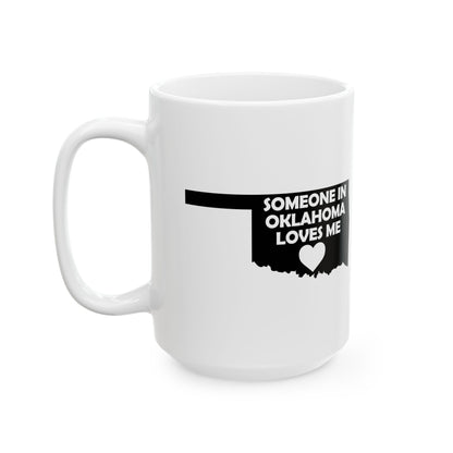 White mug with black text 'SOMEONE IN OKLAHOMA LOVES ME' on a white background