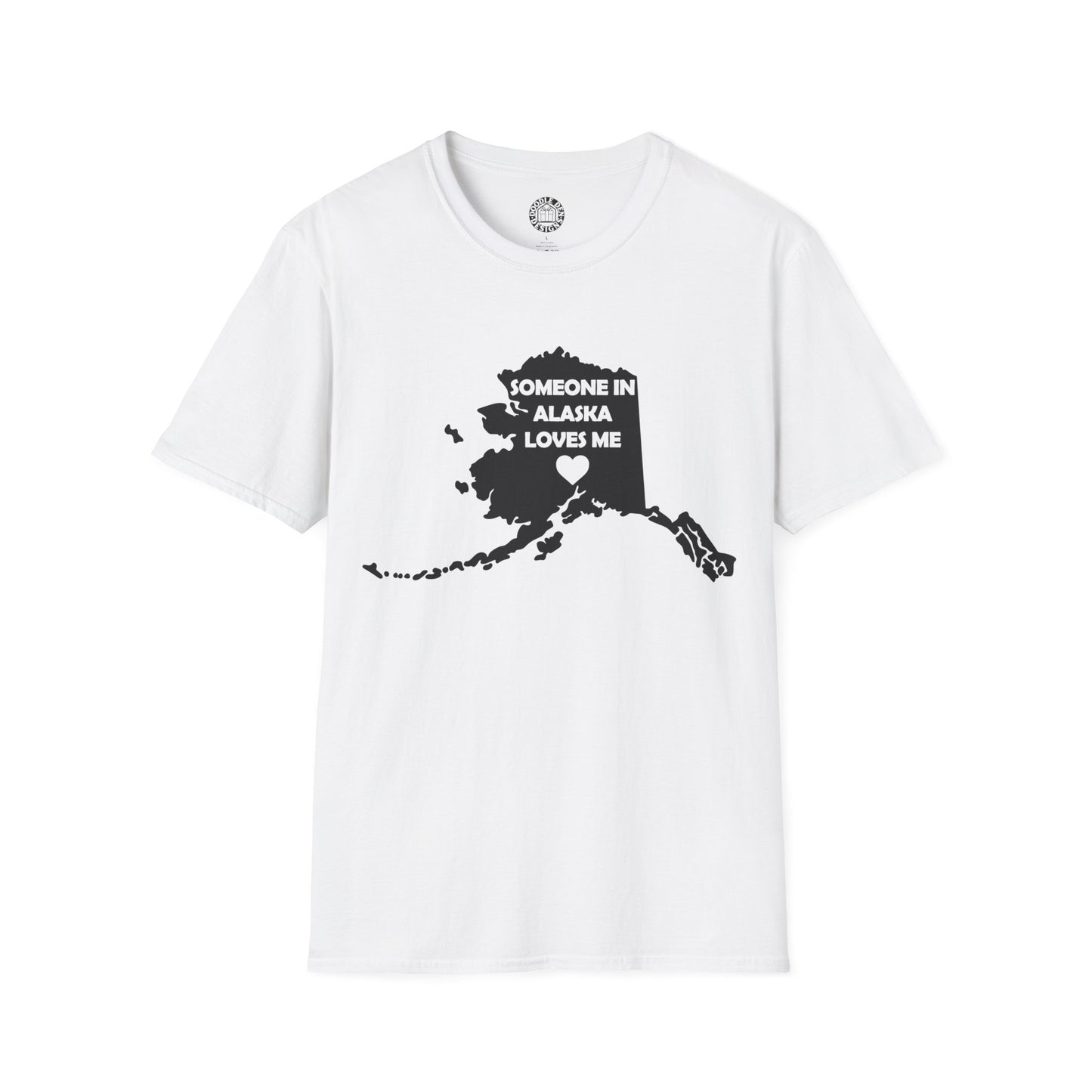 White t-shirt with black graphic of Alaska and text 'SOMEONE IN ALASKA LOVES ME' on a white background