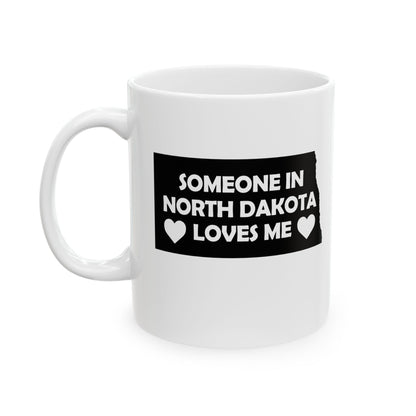 White mug with text 'Someone in North Dakota loves me' on a white background