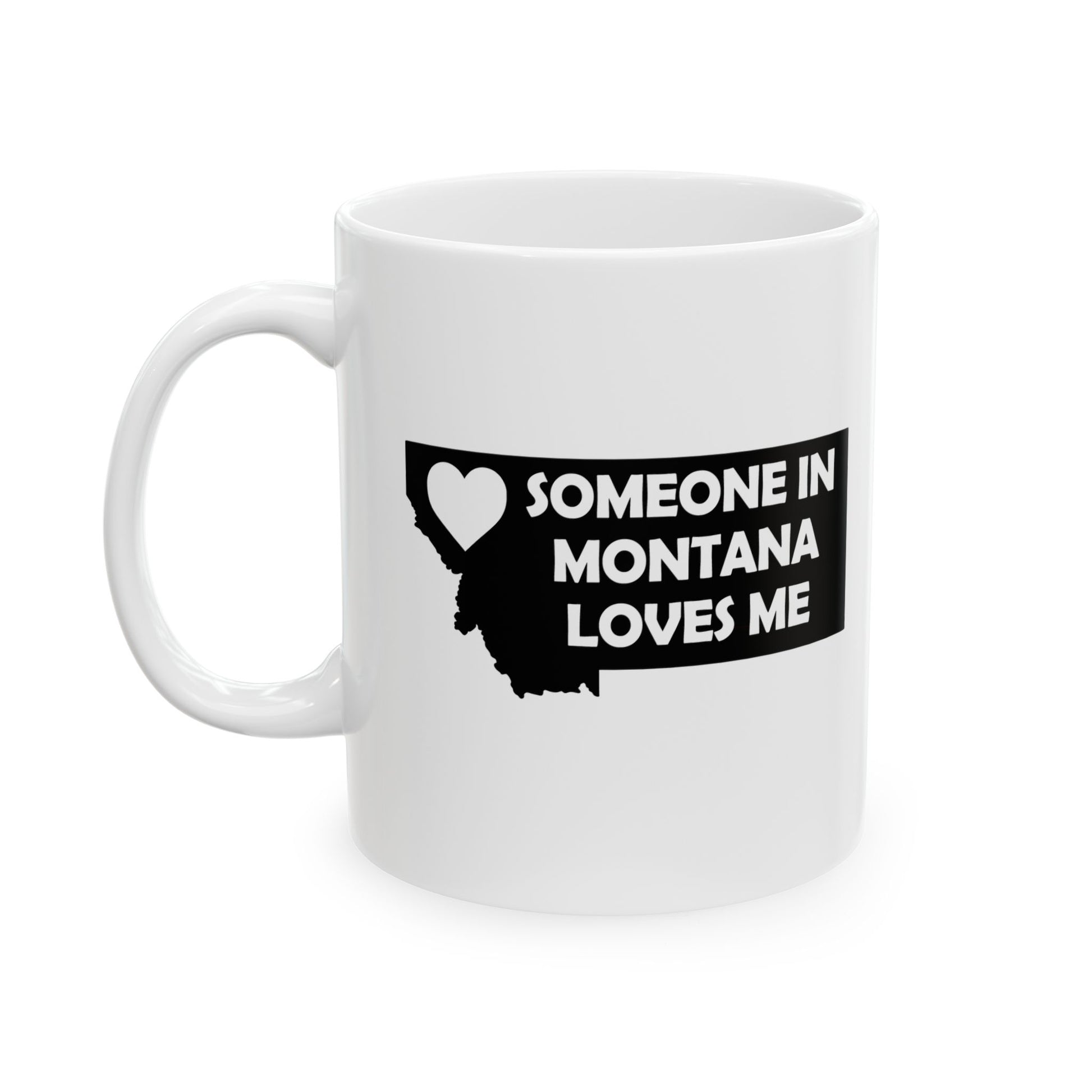 White mug with black text and heart design on a white background with text  Someone In Montana Loves Me