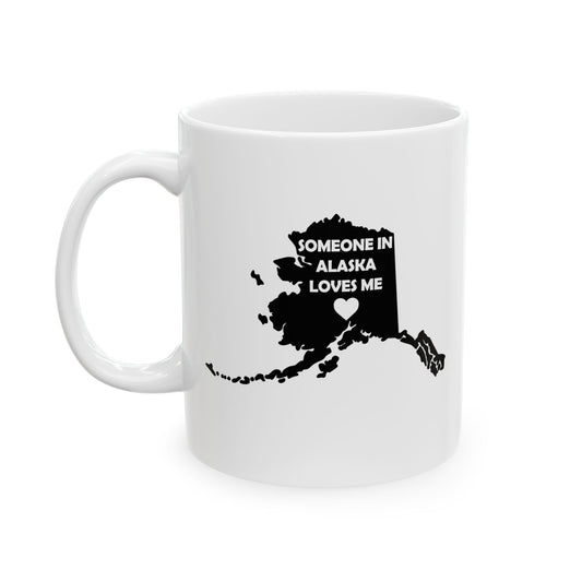 White mug with black map of Alaska and text 'Someone in Alaska loves me' on a white background