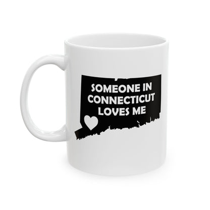 White mug with black design of Connecticut and text 'Someone in Connecticut loves me' on a white background
