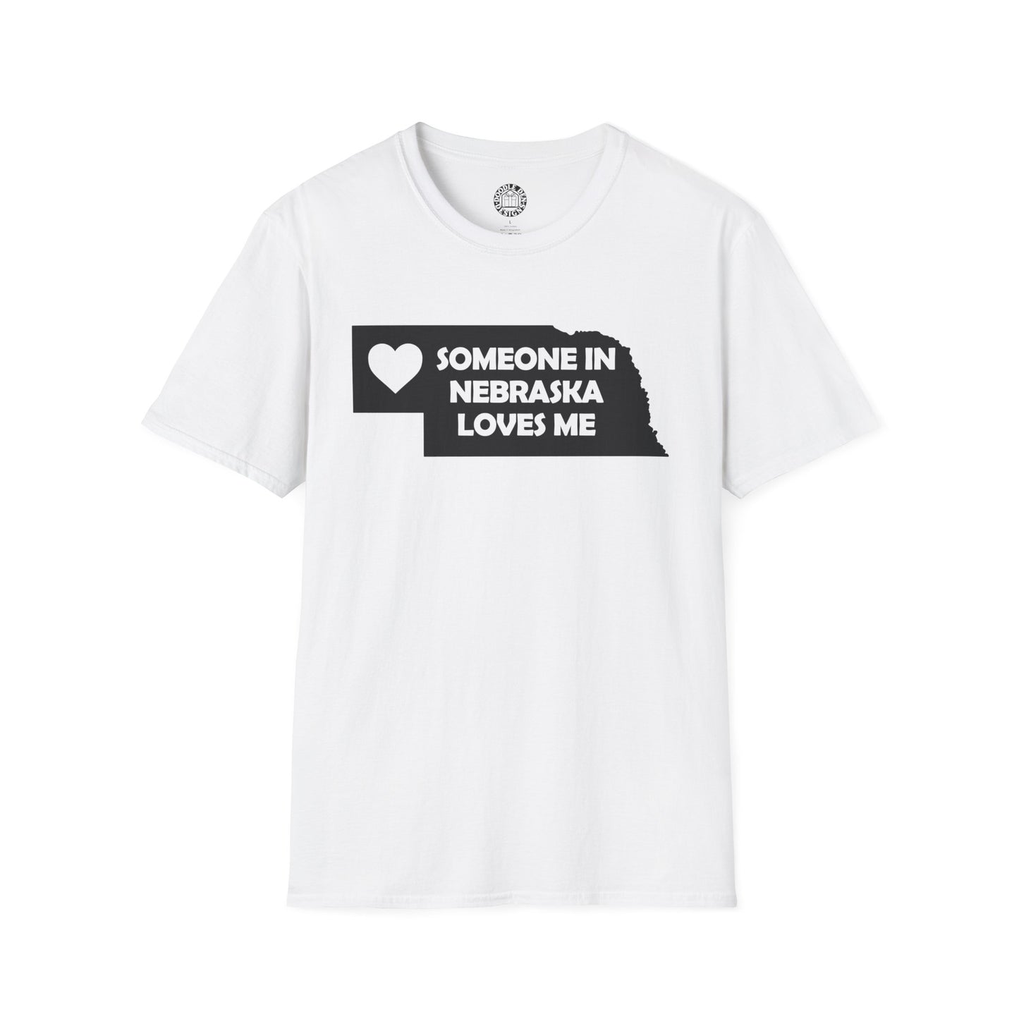 White t-shirt with black graphic and text 'SOMEONE IN NEBRASKA LOVES ME' on a white background