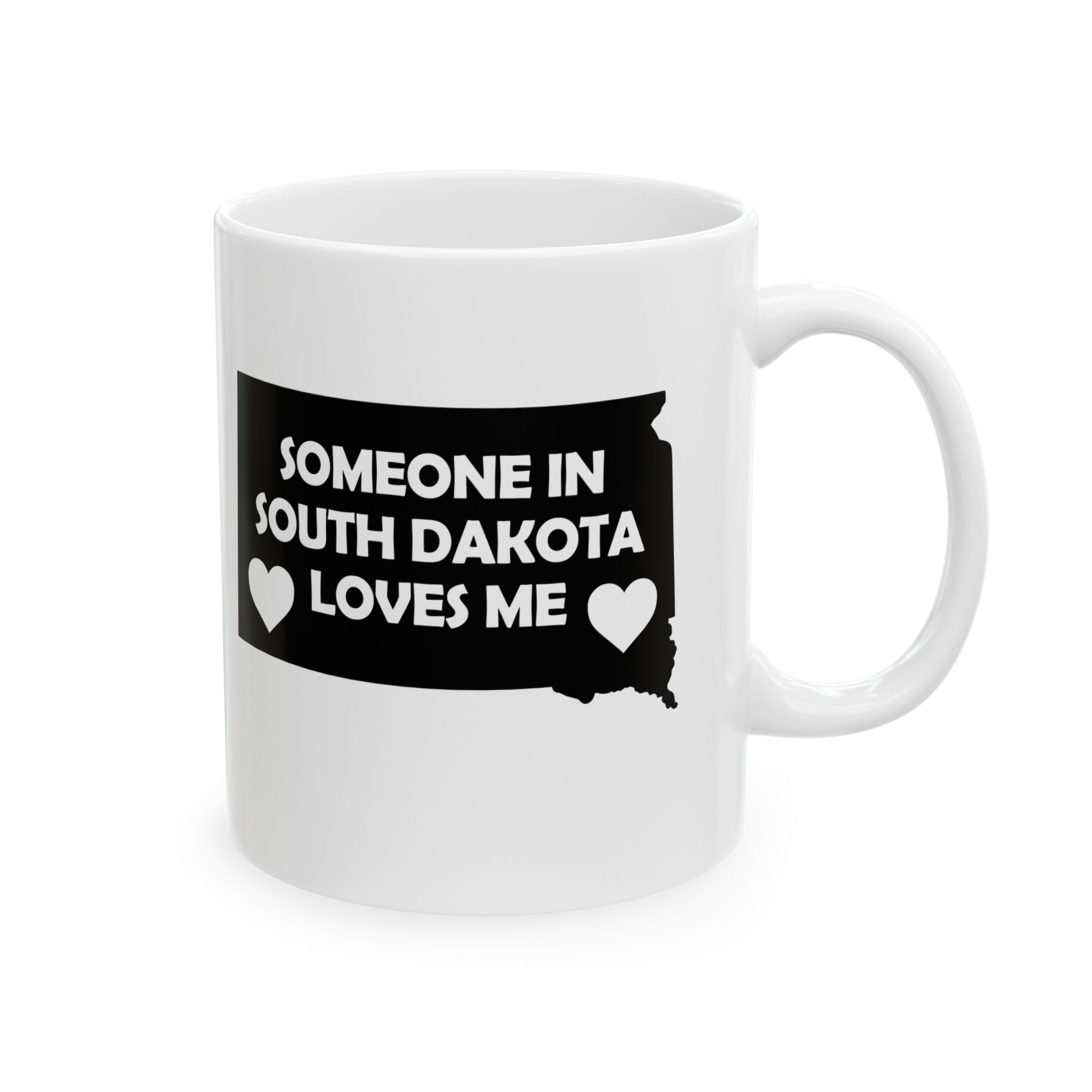 White mug with black South Dakota outline and text 'Someone in South Dakota loves me' on a white background