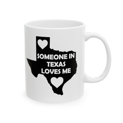 White mug with black design of Texas outline and text 'SOMEONE IN TEXAS LOVES ME' on a white background