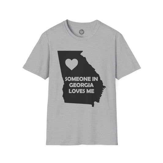 Gray t-shirt with a black silhouette of Georgia and text 'Someone in Georgia loves me' on a white background