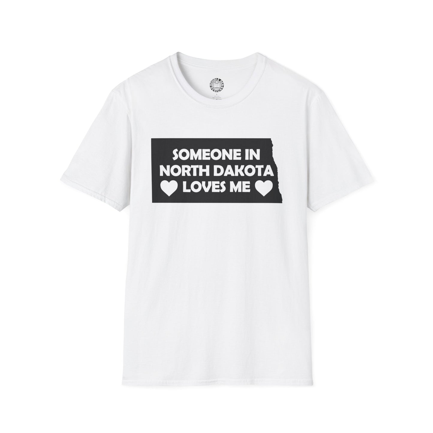 White t-shirt with text 'Someone in North Dakota loves me' on a white background