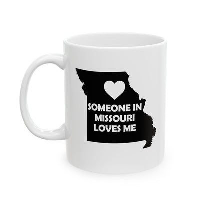 White mug with black silhouette of Missouri and text 'Someone in Missouri loves me' on a white background