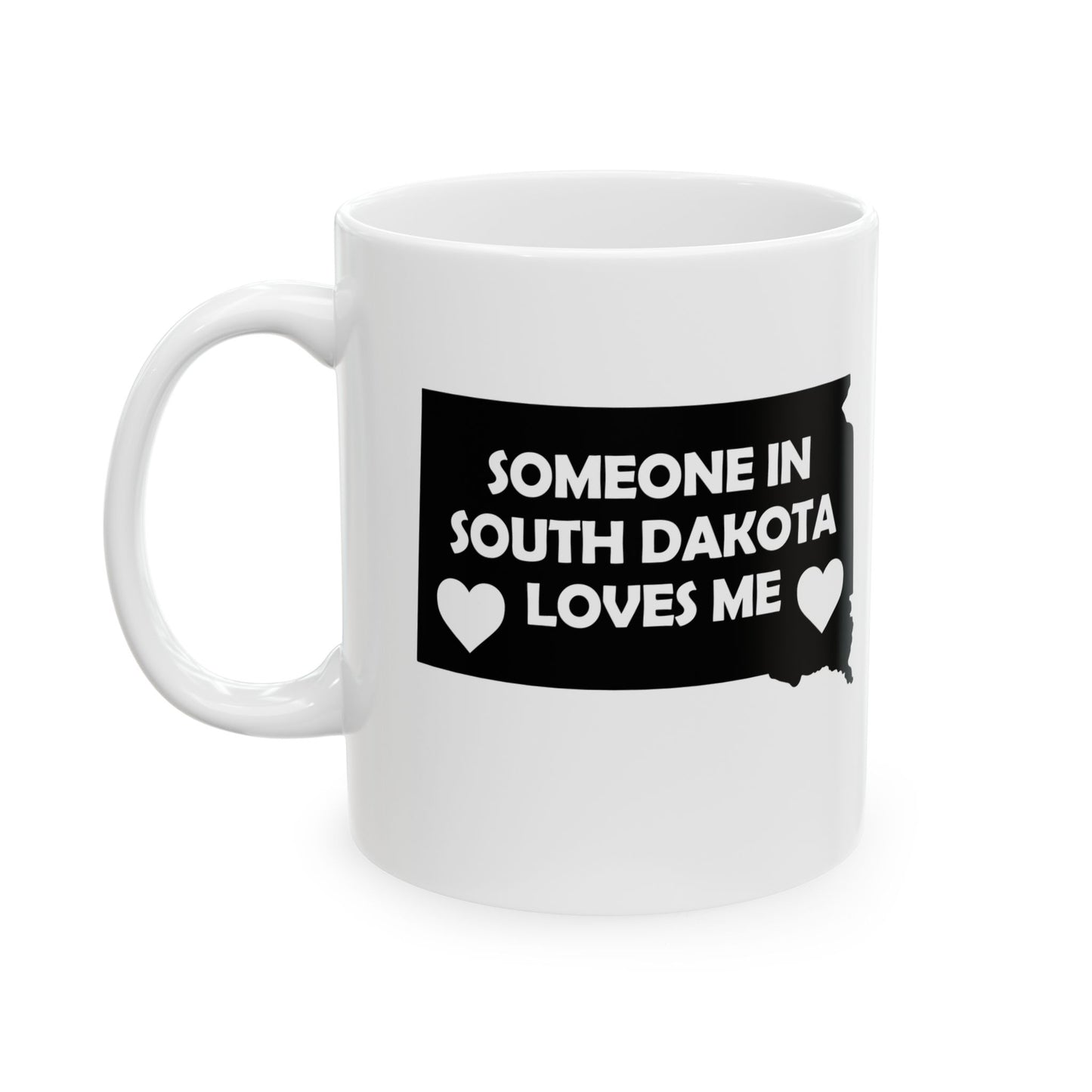 White mug with a black graphic and text 'Someone in South Dakota loves me' on a white background